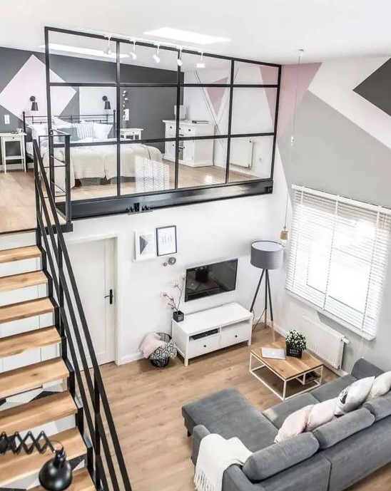 a contemporary apartment with a loft bedroom with skylights and enough space for storage is very cozy