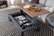 a cool coffee table with a foldable tabletop for having drinks or snacks or even working here