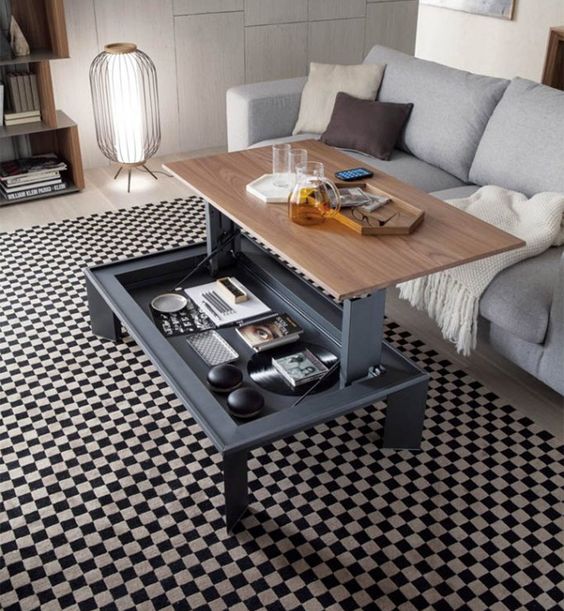 a cool coffee table with a foldable tabletop for having drinks or snacks or even working here