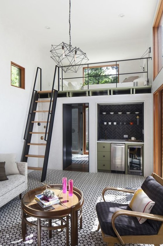 a cool small home with a kitchen and living room downstairs and a loft bedroom upstairs is a gorgeous mid-century modern dwelling