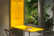 a folding desk or dining table in sunny yellow can be hidden anytime, and the chair is folding too