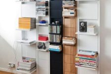 a large wall-mounted storage unit with various foldable shelves that can be hidden anytime
