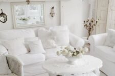 an all-white living room design in vintage style