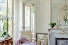 a super elegant living room with a Parisian feel and hardwood parquet floors of a neutral warm shade