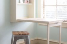 a white Murphy desk with storage shelves is great for crafters that don’t have a separate room