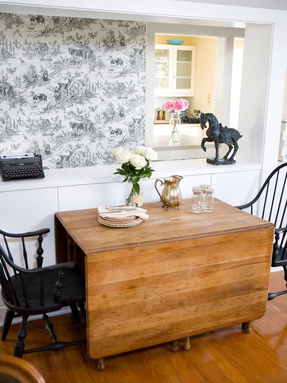 a wooden drop leaf table is a great piece for a rustic space and can be used anytime