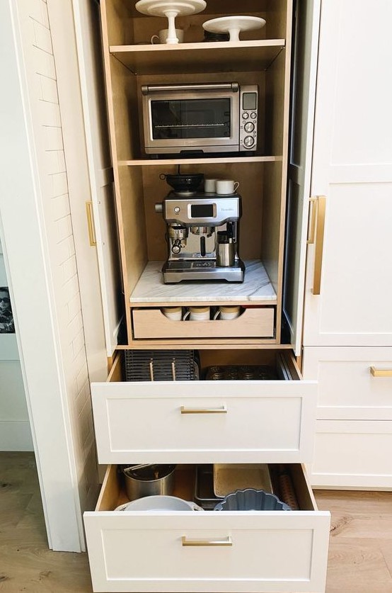 a cabinet with appliances and drawers and various tableware is a stylish solution for any kitchen