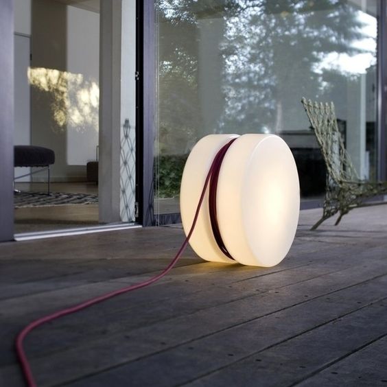 a cool modern outdoor lamp shaped as a roll with cords is a lovely idea for both indoors and outdoors and it looks awesome