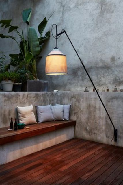 a creative outdoor wall lamp resembling a traditional indoor floor lamp is a cool way to add coziness to the space
