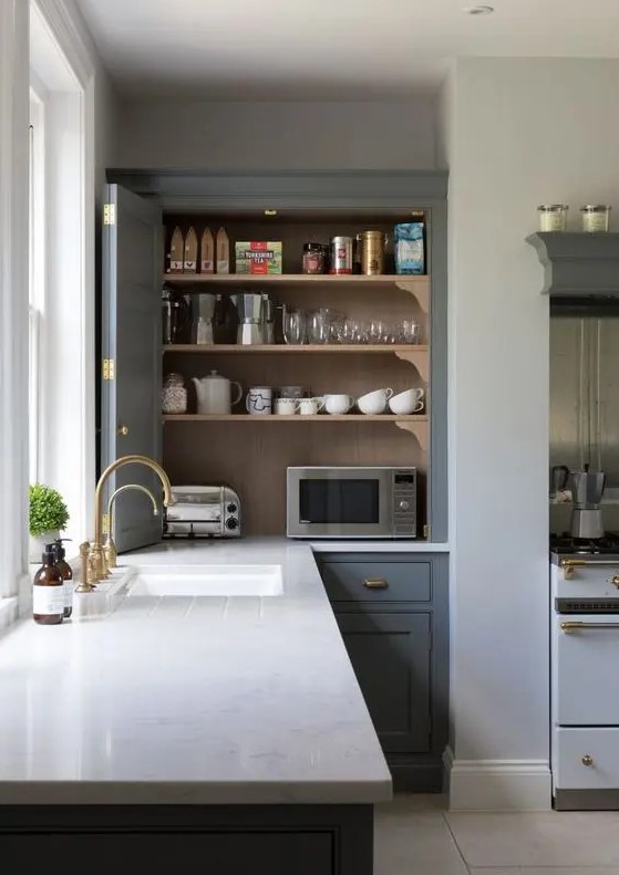 a kitchen cabinet with bi-fold doors hiding several appliances and various other stuff is a cool idea