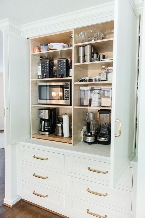 A Large Cabinet With All Kinds Of Appliances Some Bowls And Jars Is A Cool Idea To Store What You Dont Need And Hide It 