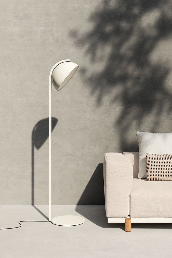 a modern white outdoor floor lamp with a round lampshade will bring coziness and an edgy feel and will blend with your space easily thanks to the universal color