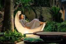 a moon-shaped lamp like this one can double as a daybed or a seat, and will give a magical feel to your outdoor space