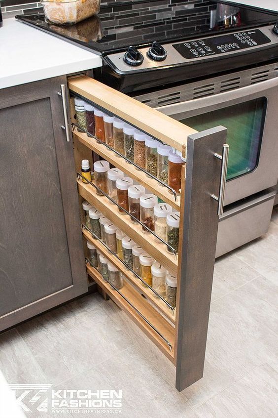 a narrow vertical drawer with spices is a cool idea for a kitchen and placed next to the cooker it will let you cook comfortably