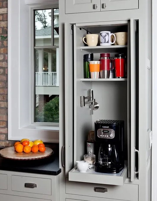 a small cabinet with shelves and a retracting one with a coffee machine is a lovely mini coffee station