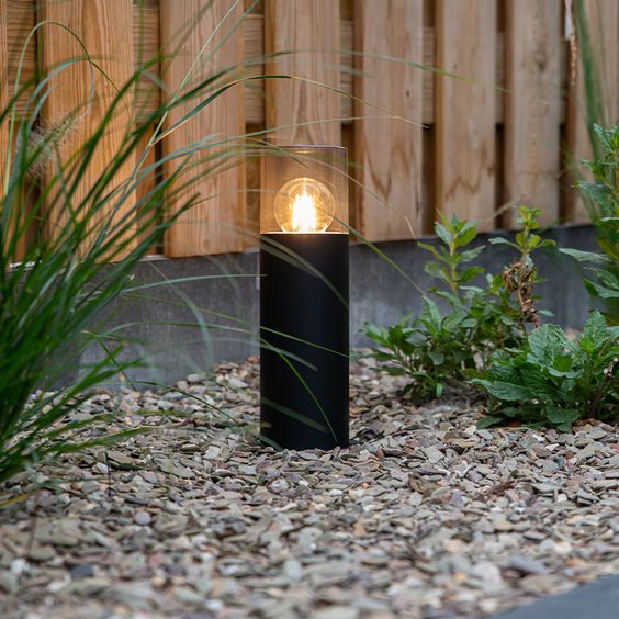 a small outdoor lamp in black is a stylish and laconic solution for a contemporary or minimalist space and it gives enough light