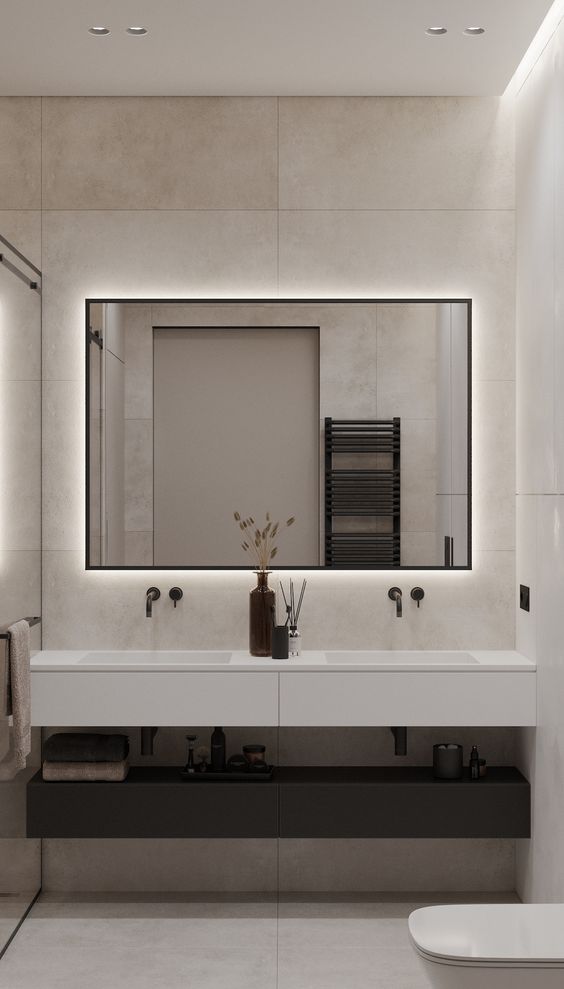 a stylish and laconic lit up mirror is always a good idea for a bathroom, it will light up the space and make it more welcoming