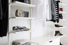 a stylish and simple white closet with open shelves, dressers and boxes overhead for storage is a cool minimalist idea
