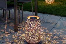 beautiful floral lasercut lanterns like these ones will fill your outdoor space with pretty floral patterns and will make your space eye-catchy