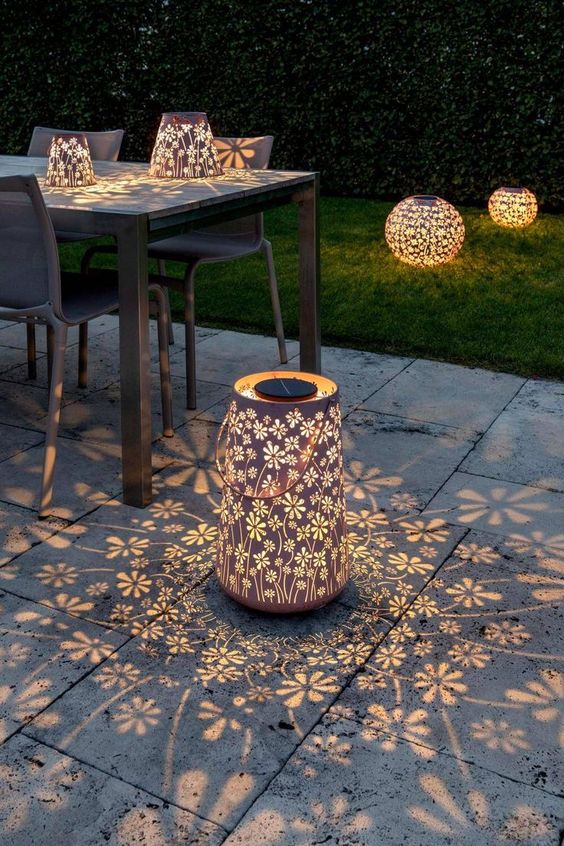 beautiful floral lasercut lanterns like these ones will fill your outdoor space with pretty floral patterns and will make your space eye-catchy