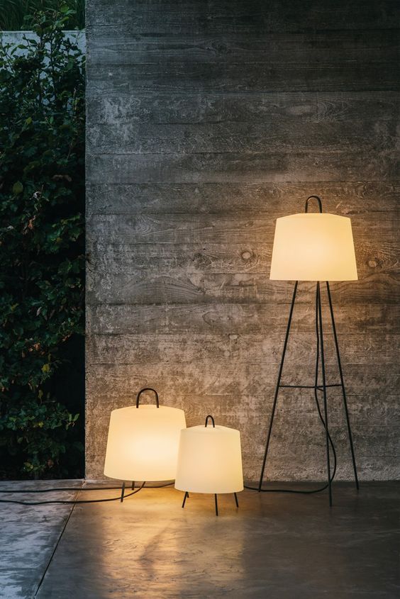 floor lamps with pretty and classic lampshades and multiple legs are great for a modern outdoor space, and handles allow moving them here and there