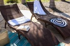 gorgeous dark curved wicker loungers with blankets and pillows are perfect for tropical, rustic and modern spaces
