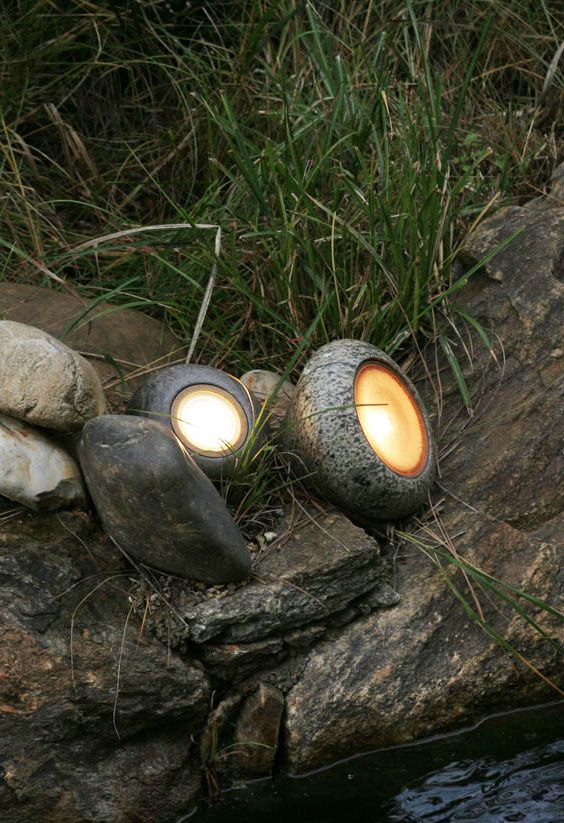 pebble like outdoor mini lamps will make your outdoor space illuminated but close to nature at the same time
