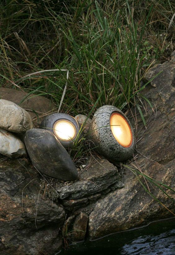 pebble-like outdoor mini lamps will make your outdoor space illuminated but close to nature at the same time