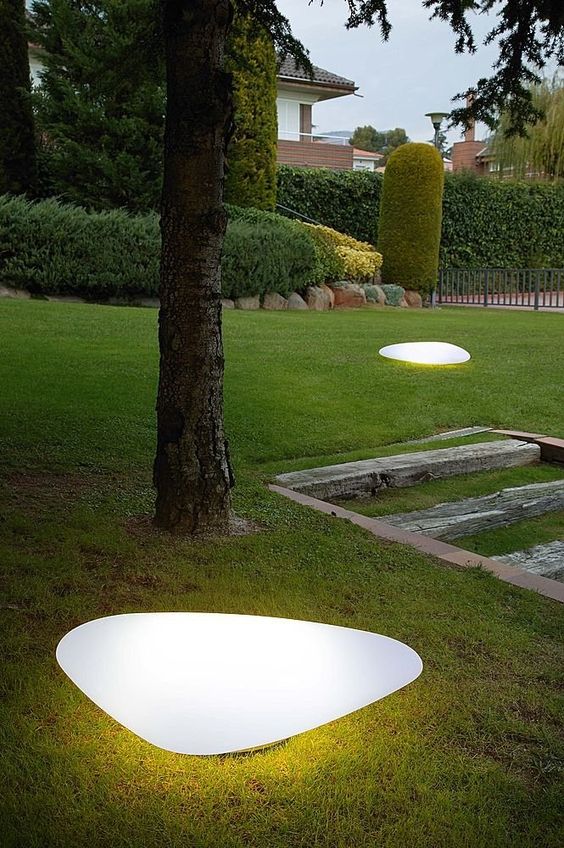 sleek modern pebble liek outdoor lamps liek these ones will instantly add curb appeal to your house and will give an edge to your outdoor space