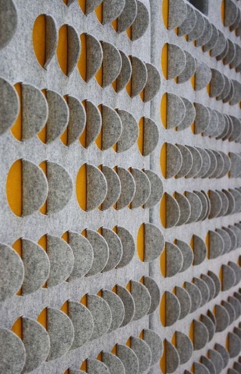 stylish grey and yellow acoustic wall panels make the space more modern and bold while soundproofing it