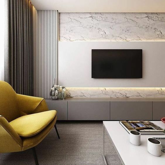 a chic beige sleek TV unit attached to the wall is a stylish solution for a modern or minimalist space