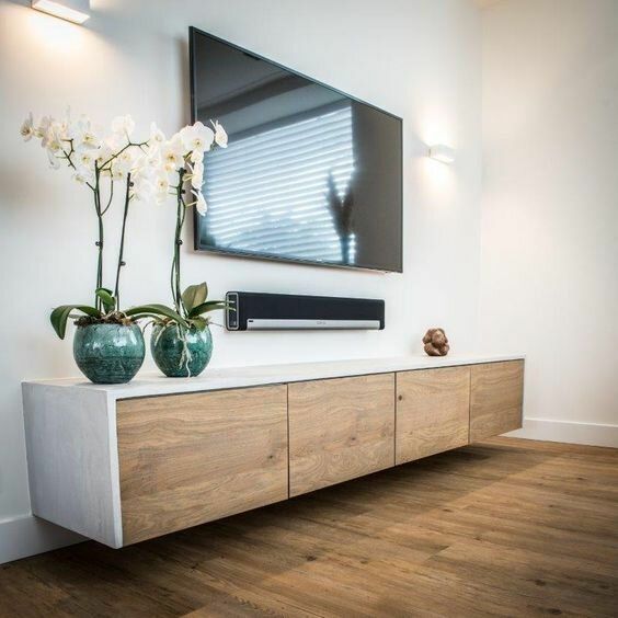 a chic whitewashed and light stained floating TV unit is a very elegant and cool idea for many rooms