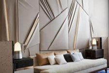 a draped fabric statement wall with lit up panels adds a chic geometric touch and a modern feel to the space