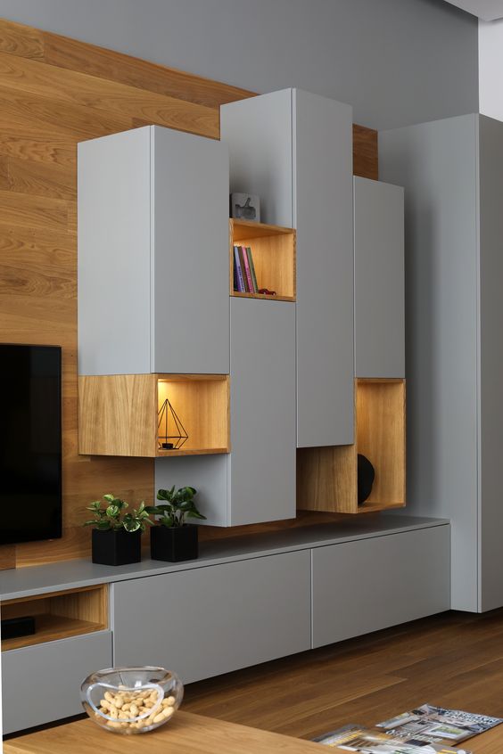 a gorgeous sleek grey and light-stained wood wall storage unit with closed and open storage compartments is a very cool idea
