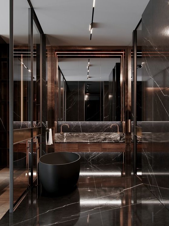 a jaw dropping chocolate brown marble bathroom with a large mirror, a black soak tub and a shower space