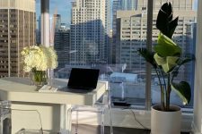 a simple neutral home office design with a view