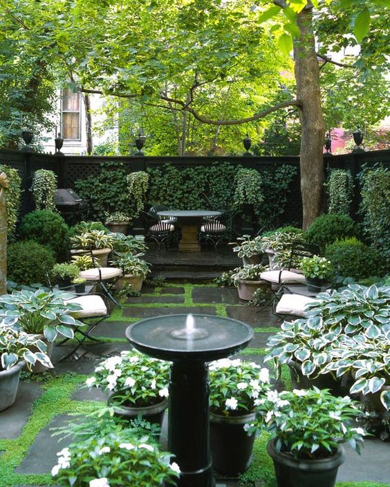 a small and classy stone pedestal fountain will be a great solution for any formal or vintage-inspired garden