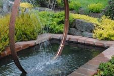 a cool backyard pond with a fountain