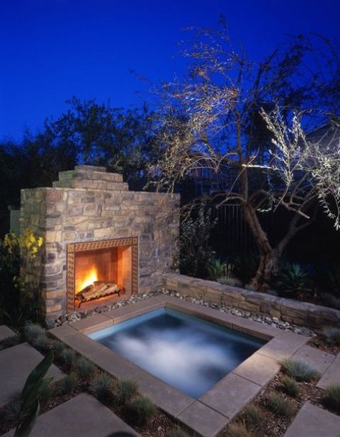 a tile clad hot tub with a fireplace next to it will give you great relaxing and soothing therapy