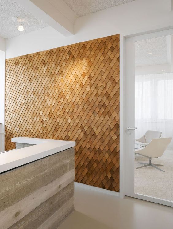 a unique textural accent wall clad with wooden shingles is a stylish contemporayr meets rustic idea