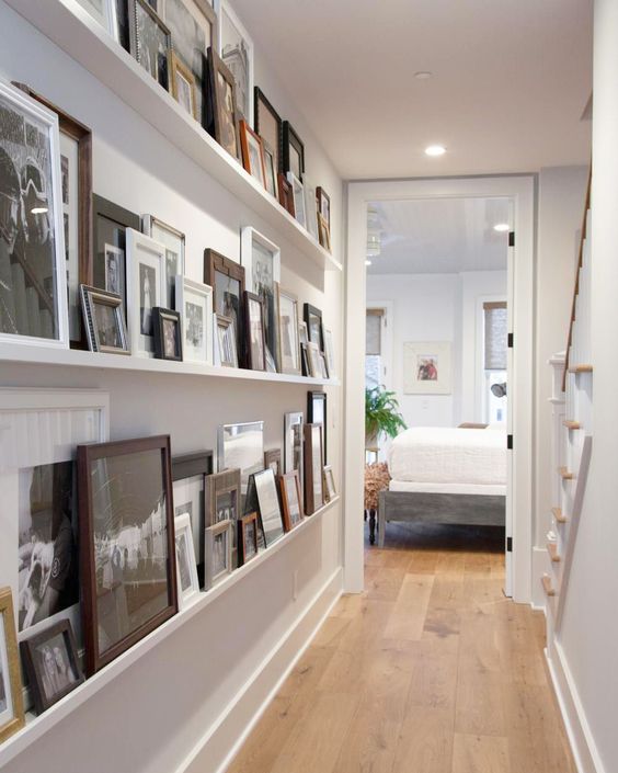 a blank wall in your corridor can be taken by long ledges, on which you can display photos and artworks