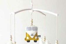 a boho nursery mobile with clouds, mountains, a van and wooden beads is a very cool and fun idea for a boho space