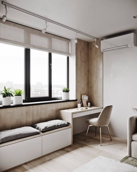 a contemporary neutral space with neutral semi-sheer Roman shades that block out the sun partly and match the room decor
