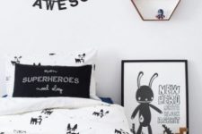a cool and fun Nordic kid bedroom with a bed, oversized Legos, a wall shelf, some pretty artworks and toys