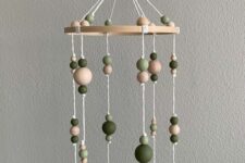 a cool wooden bead mobile with neutral and green wooden beads is a super cool idea for any space