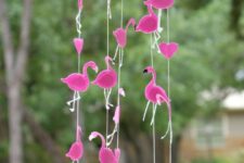 a creative and bright nursery mobile with a fluffy cloud and some hot pink felt flamingos is a cool and fun solution for a pink nursery