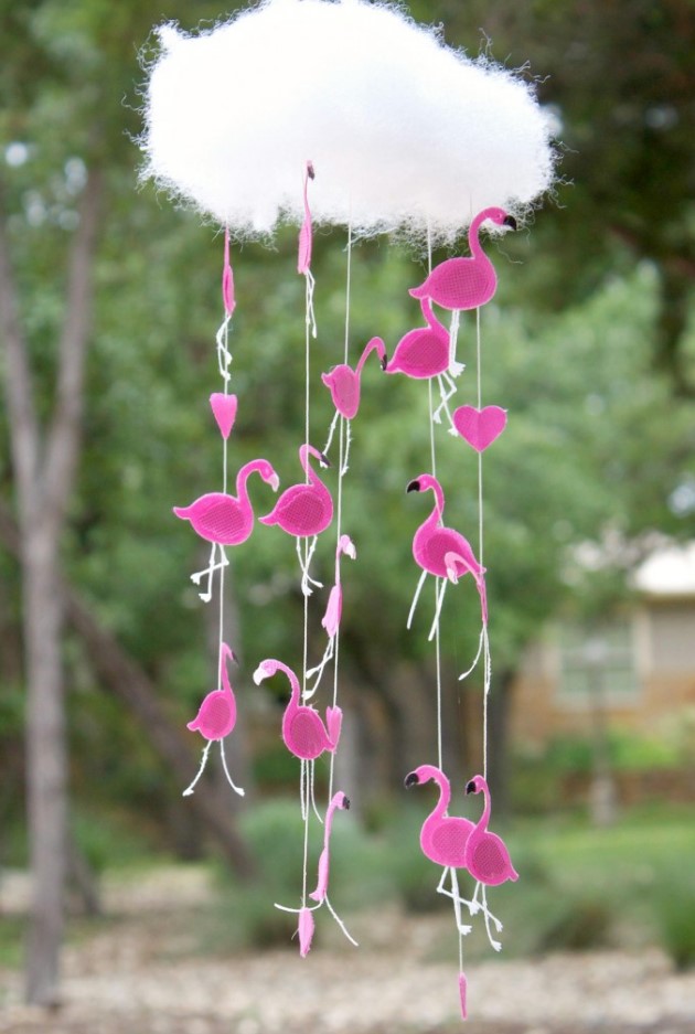 a creative and bright nursery mobile with a fluffy cloud and some hot pink felt flamingos is a cool and fun solution for a pink nursery