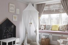 a delicate and subtle Scandi nursery with blush walls, a large windowsill bench with pillows, a bed with neutral bedding and a teepee