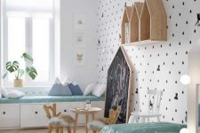 a girl’s Scandinavian bedroom with a windowsill daybed, a kid’s bed, some house-shaped shelves, a little table and chairs