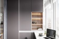 a minimalist home office with built-in storage units and shelves, a tall shared desk and a view is a very chic nook to work or have meals
